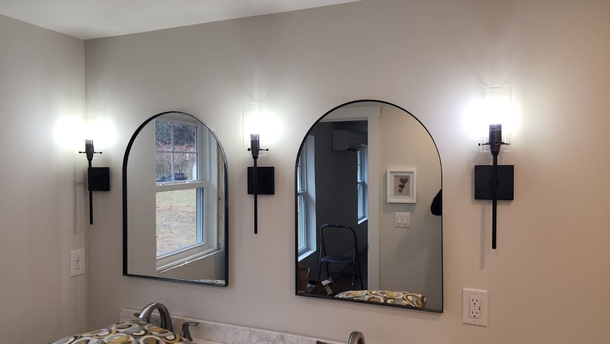 Bathroom remodel with arched mirrors and wall sconces wired by Electric Wizard