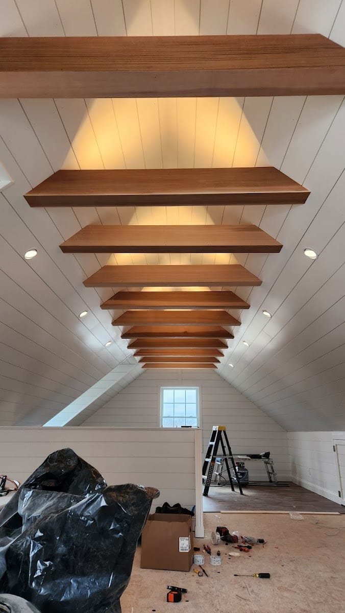 Vaulted shiplap ceiling with wood beams and recessed lighting